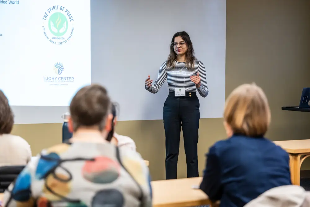 presenter talking at a conference