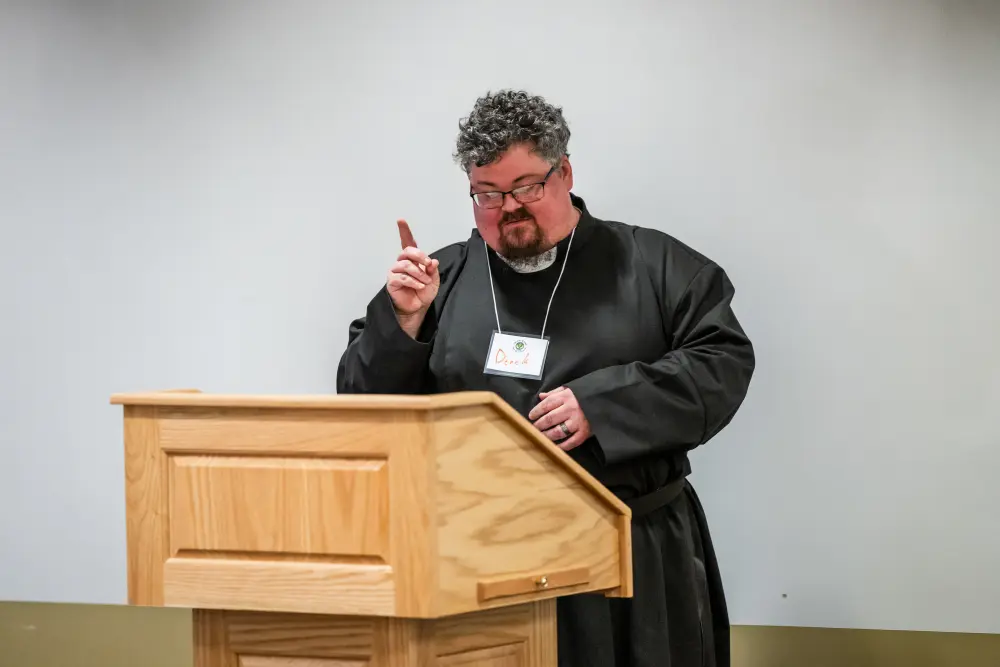 person speaking at a podium