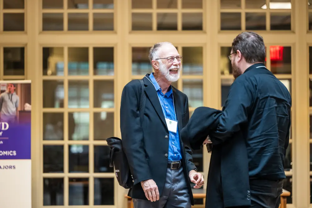 2 people talking and smiling