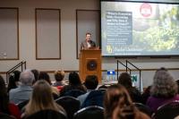 Matthew Lee speaking at 2025 ACN Conference