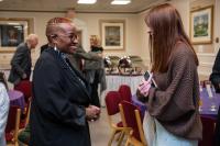 Rev. Naomi Tutu speaking with a supporter