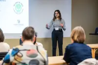 presenter talking at a conference