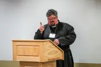 person speaking at a podium