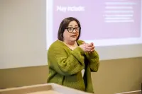 presenter talking at a conference