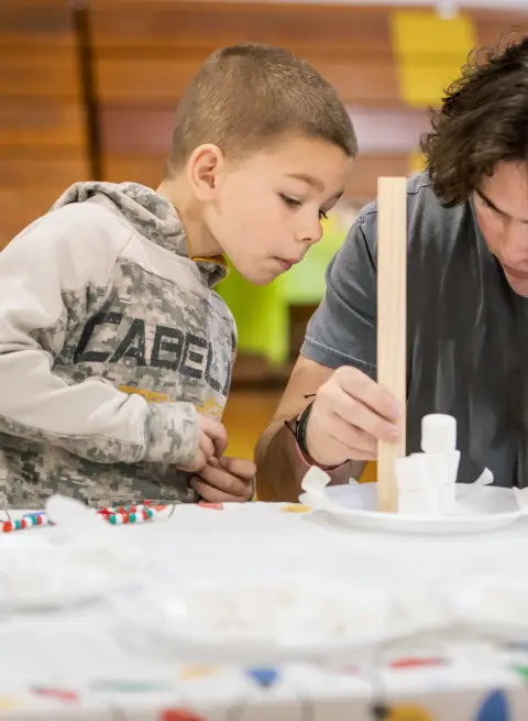 education student with elementary student