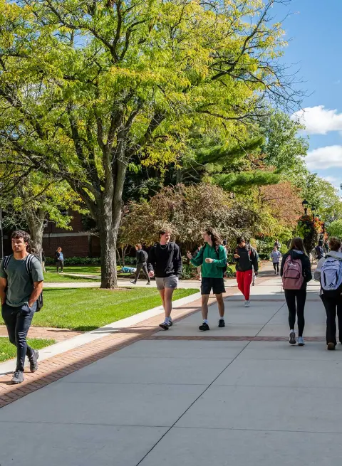 students walking across campus