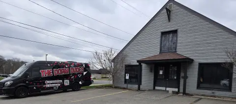 Dorm Dudes van and second building