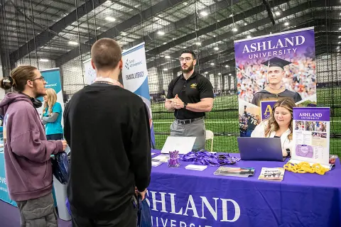 AU admissions table at 2025 Junior Achievement event