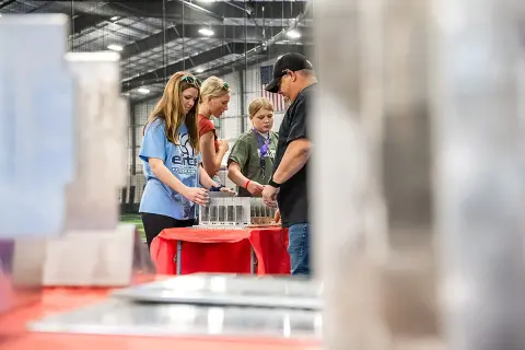 Students trying new things at 2025 Junior Achievement event