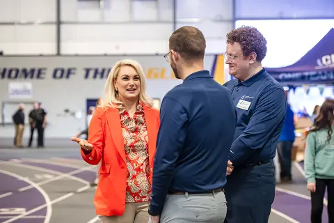 State Representative Melanie Miller speaks with JA officials at 2025 Junior Achievement event