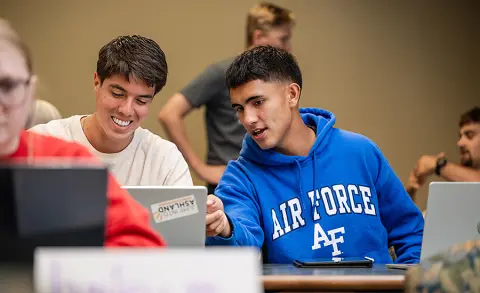 Military-connected student Alex Ocampo is pictured in class with fellow students