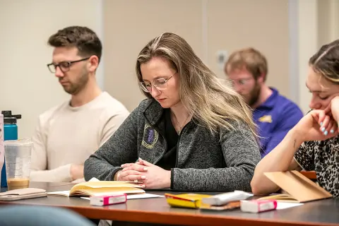 Physician assistant student Alyssa Burley meditates during the Healer's Art Course in 2025