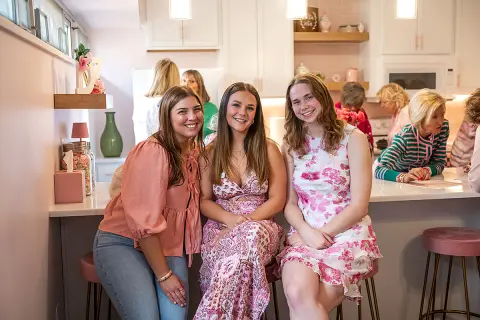 photo of current Delta Zeta members and renovated kitchen area