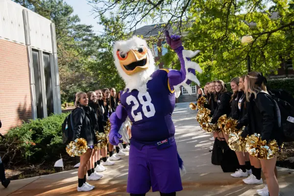 Tuffy mascot with cheerleaders