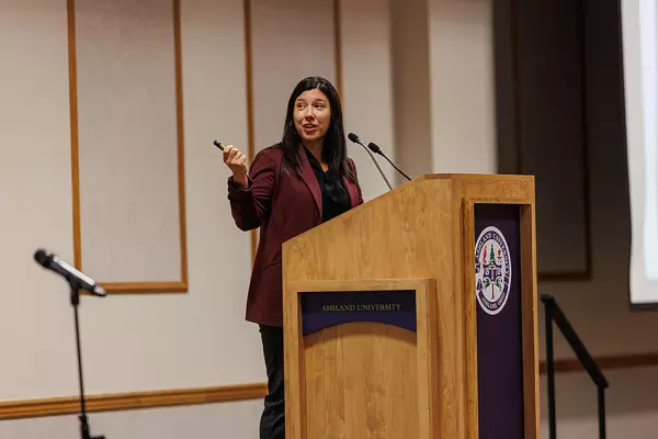 Jillian Peterson speaking at Symposium Against Indifference