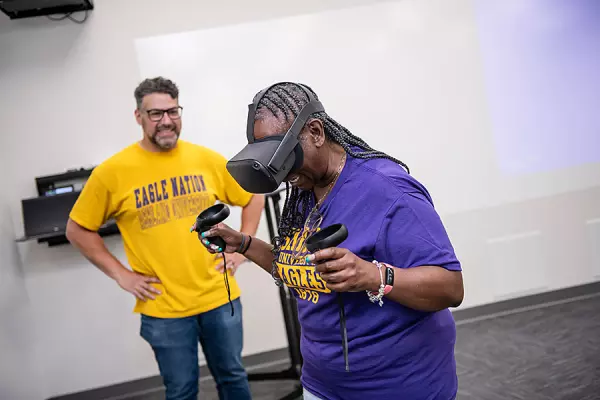 a teacher trying VR at the Telecommunications Bootcamp for Educators