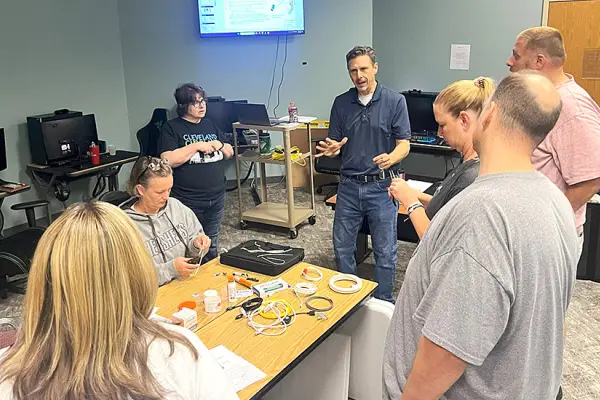 Workforce Development Program Director Joe Kacsandi with local educators at the Telecommunications Boot Camp