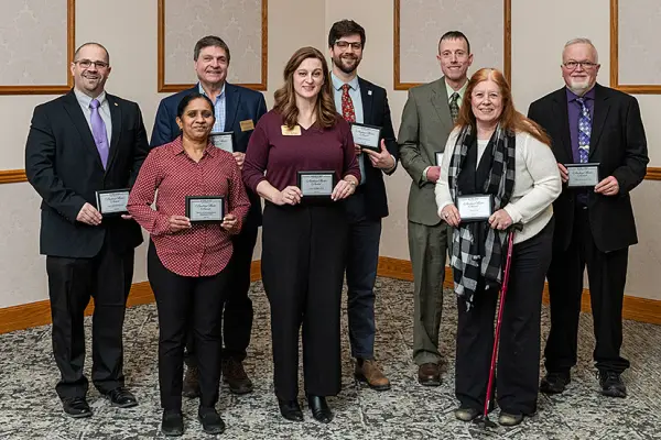 Recipients of the 2026 Academic Mentor Awards pose with their plaques