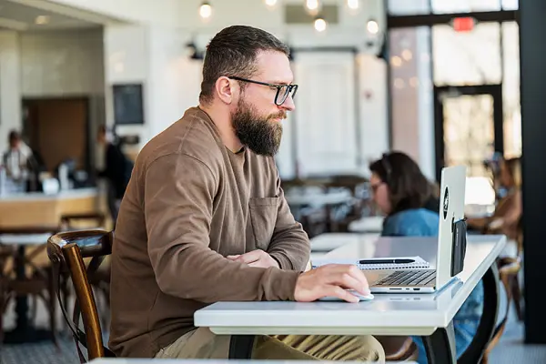 adult student on laptop at Lyceum Cafe