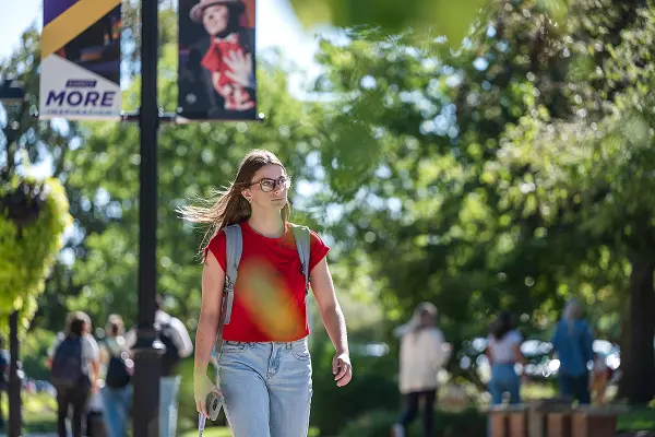 female student walking to class on first day of 2025 fall semester
