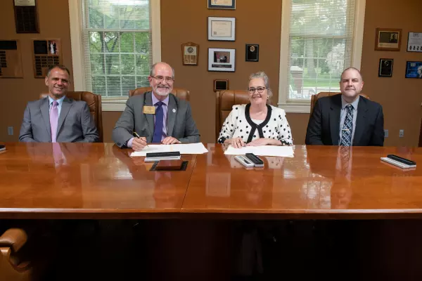 AU administration signing agreement with NCSC