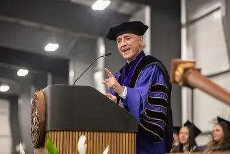 AU President Carlos Campo speaking at 2024 commencement