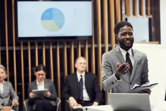 cheerful businessman sharing development strategy