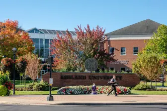 Student walking across campus