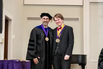 Student Robert Mouledoux, winner of the Senior Award in both the Department of History and the Department of Music, is pictured with Greg McBrayer, Ph.D. 