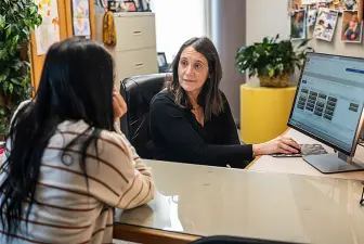 Professional advisor Kristina Cunningham works with a student in the Student Success area 