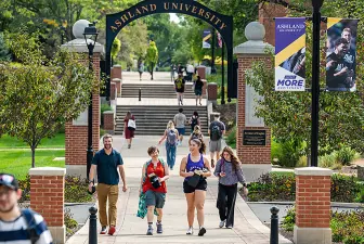 Faculty and students walking on the Avenue of Eagles on first day of class 2026