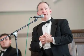 Dr. Ron Blackley speaking during choir concert