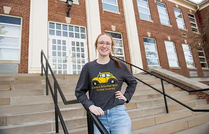 Maeve Kelly in front of Founders Hall