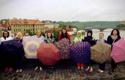 Study Abroad students with umbrellas