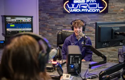 students on air at WRDL radio station