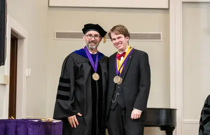 Student Robert Mouledoux, winner of the Senior Award in both the Department of History and the Department of Music, is pictured with Greg McBrayer, Ph.D. 
