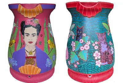 painted rain barrels by Cynthia Petry (left) and Grace Crall (right)