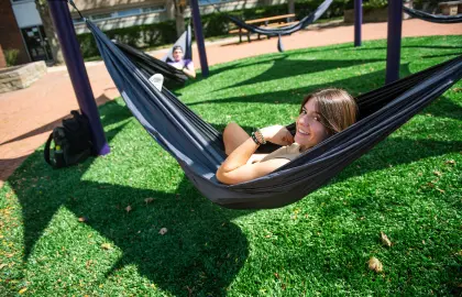 Student relaxing in hammock