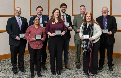 Recipients of the 2026 Academic Mentor Awards pose with their plaques