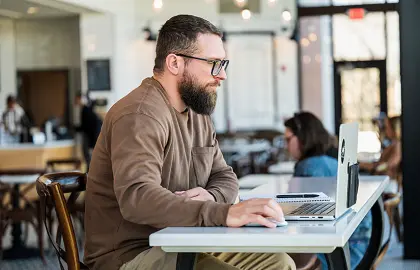 adult student on laptop at Lyceum Cafe