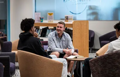 Austin Brenner offering spiritual guidance to current student-athletes