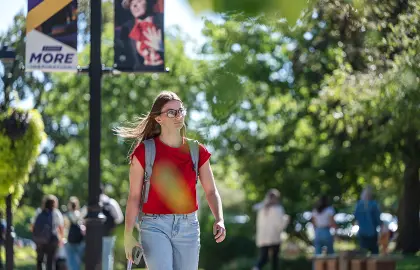 female student walking to class on first day of 2025 fall semester