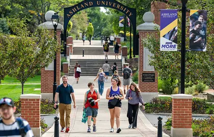 Faculty and students walking on the Avenue of Eagles on first day of class 2026
