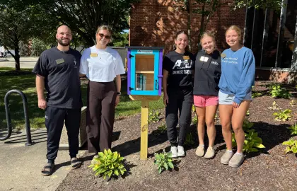 little library in wood and students