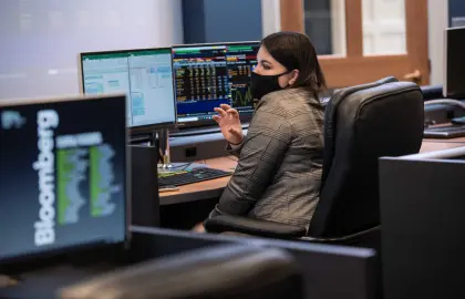 Business student investing on computer