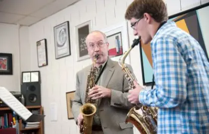 Tom Reed giving a saxaphone lesson