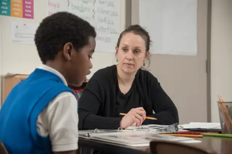 Student teacher working with a student