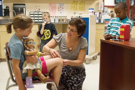 school nurse helping a student