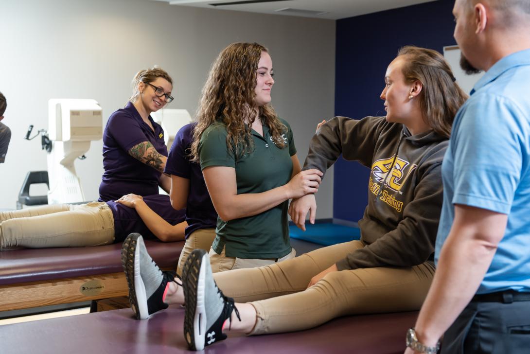 Athletic Training student practices working with a patient