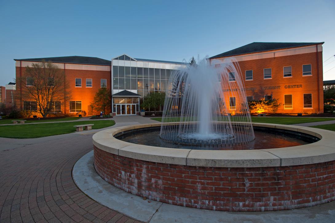 Fountain in front of the Hawkins-Conard Student Center at night